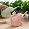Baby elephant watering flowers - Image 7