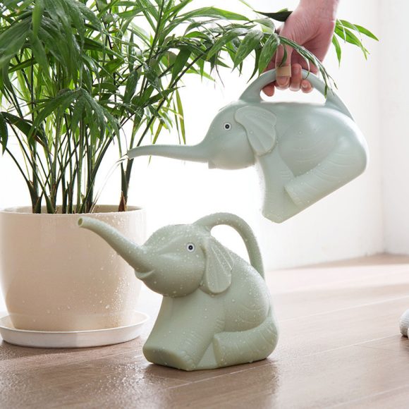 Baby elephant watering flowers - Image 6