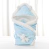 Newborn baby being hugged and swaddled by baby - Image 3